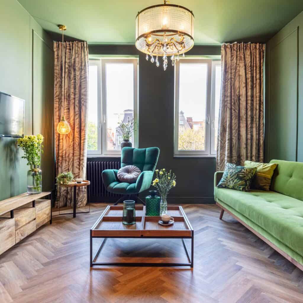 Hipstoric living Room with green couch and green